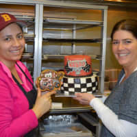 <p>Baker Genesis Caraballo, left, and owner Pam Nicholas, right, show off a custom birthday cake for a very lucky little boy at Izzi B&#x27;s in Norwalk.</p>