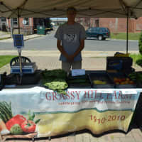 <p>Ryan Wohlert from Grassy Hill Farm sells produce.</p>