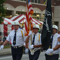 <p>Members of an American Legion post march in the Mahopac Volunteer Fire Department&#x27;s dress parade.</p>