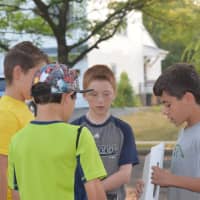 <p>Benjamin Franklin Middle School sixth graders compare schedules before walking to school Wednesday.</p>