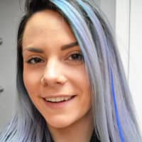 <p>Industrie Stylist Kelsey Grycan of Westwood gets way into the spirit of the blue hair extension fundraiser.</p>