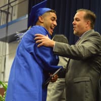 <p>A happy graduate at the Abbott Tech High School commencement exercises Monday evening at WestConn in Danbury.</p>