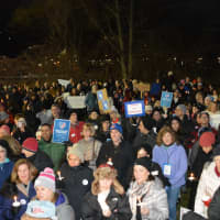 <p>Demonstrators at a Chappaqua interfaith vigil hold candles. The vigil was held to protest President Donald Trump&#x27;s ban on admitting refugees into the country.</p>