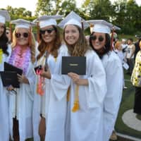 <p>A group of happy graduates at the Shelton High commencement.</p>