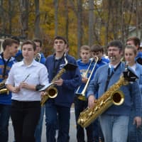 <p>North Salem High School band students march in a procession from the old Croton Falls firehouse to the new one.</p>