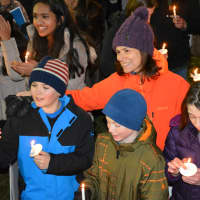 <p>Demonstrators at a Chappaqua interfaith vigil hold candles. The vigil was held to protest President Donald Trump&#x27;s ban on admitting refugees into the country.</p>
