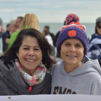 <p>Angela Swift (right) has been a regular participant in the Old Greenwich on New Year&#x27;s Day Dip at Tod&#x27;s Point for many years. She also came up with the idea of selling T-shirts to benefit Kids in Crisis.</p>
