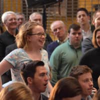 <p>A young woman asks a question at the John Kasich Town Hall Meeting in Fairfield.</p>