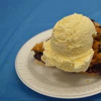 <p>A slice of blueberry pie with a scoop of ice cream on top — a crowd favorite at the Blueberry Festival.</p>
