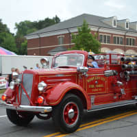 <p>An antique Mohegan Lake firetruck is driven in the Mahopac Volunteer Fire Department&#x27;s dress parade.</p>