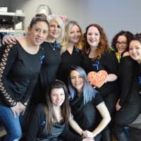 <p>The staff of Industrie Hair Gurus in Ridgewood, hosts of the blue hair extension fundraiser for International Childhood Cancer Awareness Day.</p>