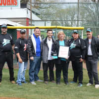 <p>The Kneisler family is presented with a plaque renaming the snack stand &quot;Coach Ned Kneisler Snack Stand.&quot;</p>