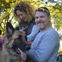 <p>Franco the German Shephard and John hang out at Woofstock.</p>