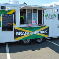 <p>It is the grand opening of a new food truck — All Good Food — at Blues on the Beach.</p>