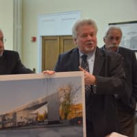 <p>Architect Ira Grandberg (left) and attorney Charles Martabano (right) present a proposal for a new building for downtown Mount Kisco at a Planning Board meeting.</p>