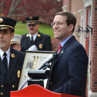 <p>State Assemblyman David Buchwald (right) presents a proclamation to Croton Falls Board of Fire Commissioners Chairman Angelo D&#x27;Agostino (left).</p>