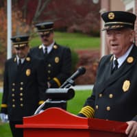 <p>Croton Falls Fire Commissioner Drew Outhouse speaks at the dedication of the new firehouse.</p>