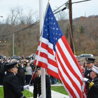 <p>A flag-raising ceremony is held at the new Croton Falls firehouse.</p>