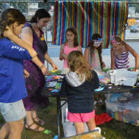 <p>Kids work on arts and crafts activities.</p>