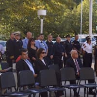 <p>Norwalk&#x27;s first responders stand at attention during the Sept. 11 remembrance ceremony Friday.</p>