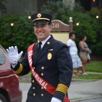 <p>Former Mount Kisco Fire Chief Mario Muccioli marches in the fire department&#x27;s annual parade as grand marshal.</p>