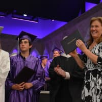 <p>Former Katonah-Lewisboro school board Trustee Janet Harckham prepares to deliver her daughter&#x27;s diploma.</p>