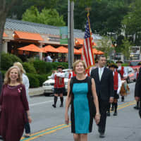 <p>Members of Mount Kisco&#x27;s village board of trustees march in the fire department&#x27;s parade.</p>