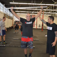 <p>Guerrilla Fitness Paramus owner Joe Ghaznavi guides Wilcomes during lunges.</p>