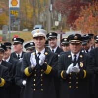 <p>Firefighters give their applause at the dedication of the new Croton Falls firehouse.</p>