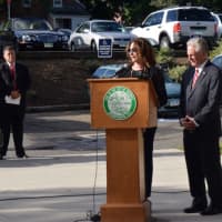<p>Kathryn Hebert pays tribute to her brother, Adam Lewis, one of the Norwalk residents lost during the Sept. 11 attacks.</p>
