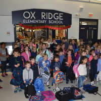 <p>Ox Ridge kids with the backpacks collected.</p>
