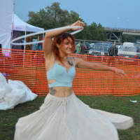 <p>A woman works the hula hoop during the concert at Shelton Sounds.</p>