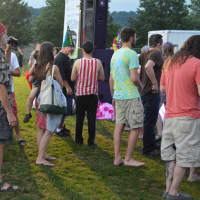 <p>People gather around in anticipation of watching The Alpaca Gnomes at Shelton Sounds.</p>