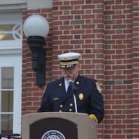 <p>New Canaan Fire Chief John Hennessey leads the Sept. 11 remembrance ceremony on the steps of Town Hall Friday.</p>