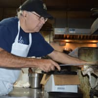 <p>Gary Barbarulo readies pizza for his 5 o&#x27;clock dinner guests at Patsy&#x27;s.</p>