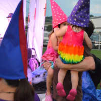<p>Little gnomes are held and danced with during the performance at Shelton Sounds with the Alpaca Gnomes.</p>
