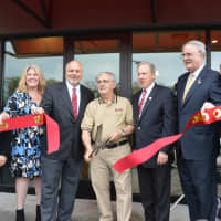<p>Charlie Osso cuts the ribbon in front of the Rudy&#x27;s new location, in the renovated Closter Plaza.</p>