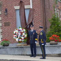 <p>New Canaan&#x27;s first responders place a wreath at the World Trade Center relic outside the fire station.</p>