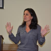 <p>Tina Bernstein, co-owner of Mount Kisco Sports, speaks in opposition to a proposed Modell&#x27;s for the former Borders site.</p>