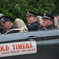 <p>Several of the Mount Kisco Fire Department&#x27;s &quot;Old Timers&quot; ride in a car for the parade.</p>