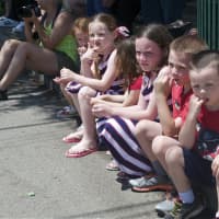 <p>Kids line up on the sidewalk to see Monday&#x27;s parade in Fishkill.</p>