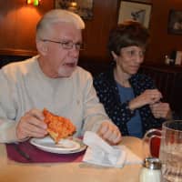 <p>Members of The Spartans chat over pizza at Patsy&#x27;s on Oct. 18.</p>