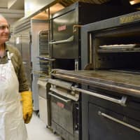<p>Making baklava, step four: Ghazi Aboueid of Paramus is in charge of baking.</p>