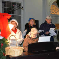 <p>Pat Reilly plays piano as part of a group from the Fox Senior Center, who helped to provide music for Mount Kisco&#x27;s annual Christmas tree lighting.</p>