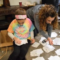 <p>Sorting postcards written by Women for Progress at the Unitarian Society of Ridgewood.</p>