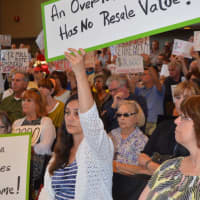 <p>Hundreds of city taxpayers converged on the Bridgeport City Council meeting Tuesday, demanding answers on their sharply higher property tax bills.</p>