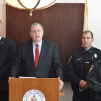 <p>Mayor David Martin honors members of the Stamford police department, who swiftly detained three suspects who fled from the scene of a homicide in Lione Park. </p>