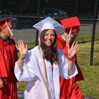 <p>An excited Somers High School 2016 graduate heads to her commencement.</p>