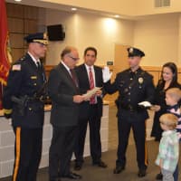 <p>East Rutherford Police Sgt. Ryan Micci is sworn.</p>