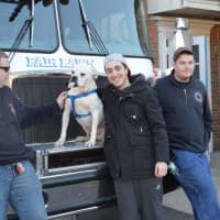 <p>Fair Lawn Volunteer Firemen and Alex Botwinick hang out while Koko gets a ride on the truck.</p>